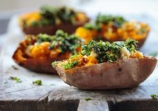 Try adding veggies, cheese and spices to your baked potatoes.